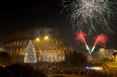 Fireworks light up the ancient Colisseum in central Rome's via dei Fori just after midnight on January 1, 2013. World cities from Sydney to Dubai rang in the New Year with a spectacular global wave of firework displays. ...