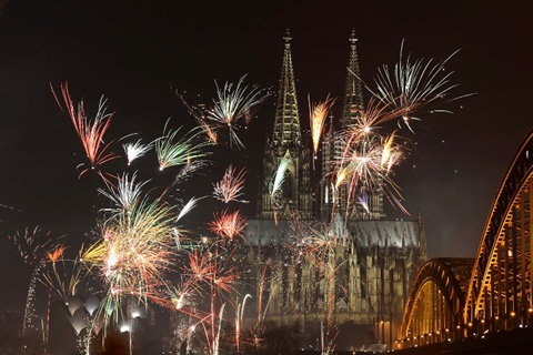 Fireworks light up the Dom church on the Rhine river in Cologne, western Germany after midnight on January 1, 2013, as part of the New Year celebrations.